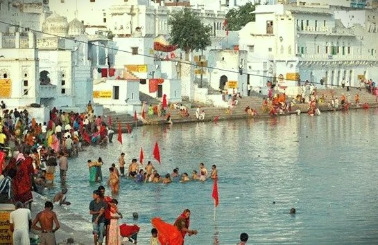 Witness pilgrims bathing at the sacred ghats of Pushkar Lake in Rajasthan, India, a spiritual highlight on a road trip connecting Jaipur to the UNESCO World Heritage Taj Mahal in Agra. Witness pilgrims bathing at the sacred ghats of Pushkar Lake in Rajasthan, India, a spiritual highlight on a road trip connecting Jaipur to the UNESCO World Heritage Taj Mahal in Agra.
