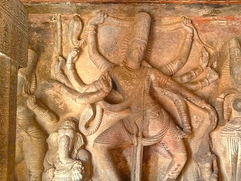 A detailed carving of the multi-armed dancing Shiva (Nataraja) inside the Ravana Pralad Cave Temple (Ravana Phadi) in Aihole, Karnataka, India, near Badami and the Pattadakal UNESCO site. A detailed carving of the multi-armed dancing Shiva (Nataraja) inside the Ravana Pralad Cave Temple (Ravana Phadi) in Aihole, Karnataka, India, near Badami and the Pattadakal UNESCO site.