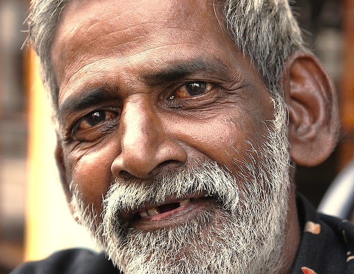 A portrait of a local man in Aihole, Karnataka, India, home to the Ravana Pralad Cave Temple, which is located near Badami and the Pattadakal UNESCO site. A portrait of a local man in Aihole, Karnataka, India, home to the Ravana Pralad Cave Temple, which is located near Badami and the Pattadakal UNESCO site.