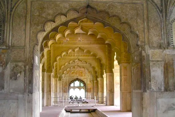 Explore the intricate scalloped arches inside the Red Fort in Delhi, India, showcasing Mughal architecture, historic monument interior design, cultural heritage site, sandstone corridors, tourism appeal, regal ambiance, iconic landmark. Explore the intricate scalloped arches inside the Red Fort in Delhi, India, showcasing Mughal architecture, historic monument interior design, cultural heritage site, sandstone corridors, tourism appeal, regal ambiance, iconic landmark.