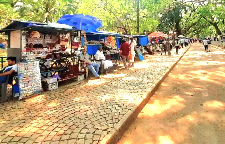 Tourists browse souvenir stalls along a cobblestone path in Kochi, India, a popular activity near the Chinese fishing nets and the neighboring state of Karnataka. Tourists browse souvenir stalls along a cobblestone path in Kochi, India, a popular activity near the Chinese fishing nets and the neighboring state of Karnataka.
