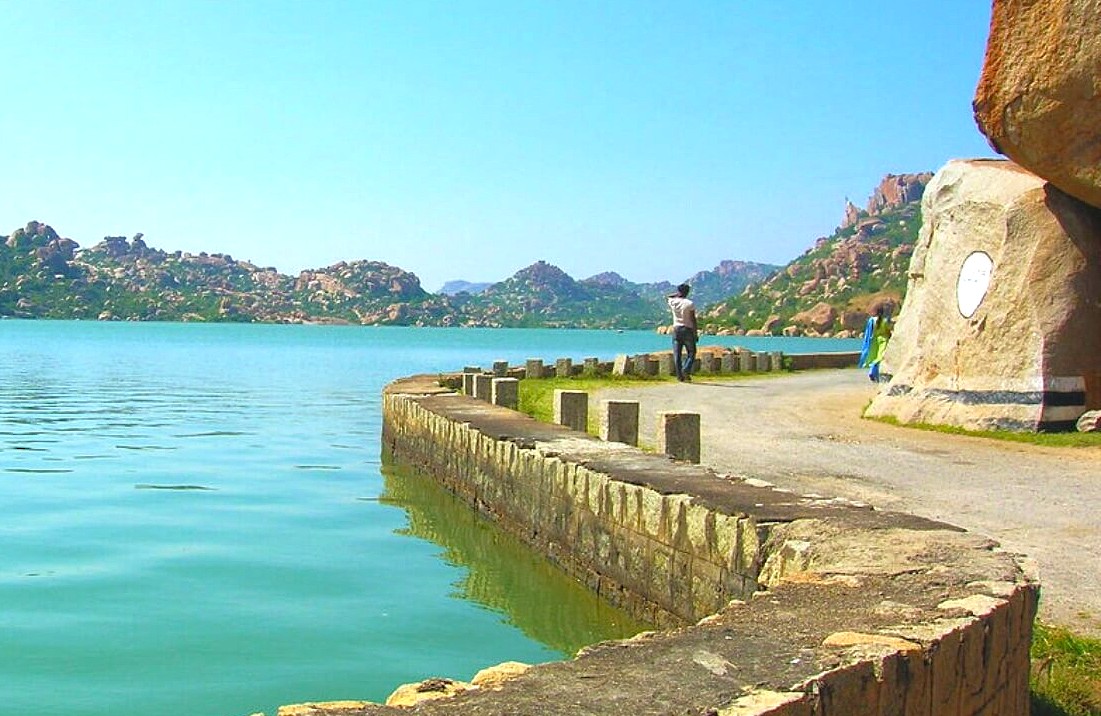 Take a scenic walk around Sanapur Lake in Hampi, Karnataka, India, a UNESCO site located near the Vittala Temple, Queen's Baths, and the famous elephant stables. Take a scenic walk around Sanapur Lake in Hampi, Karnataka, India, a UNESCO site located near the Vittala Temple, Queen's Baths, and the famous elephant stables.