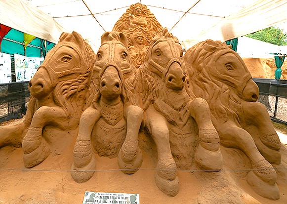 "Intricate sand sculpture of five royal horses at Mysore Sand Sculpture Museum in Karnataka, India, showcasing expert craftsmanship, cultural storytelling, festival art, and historical legacy."