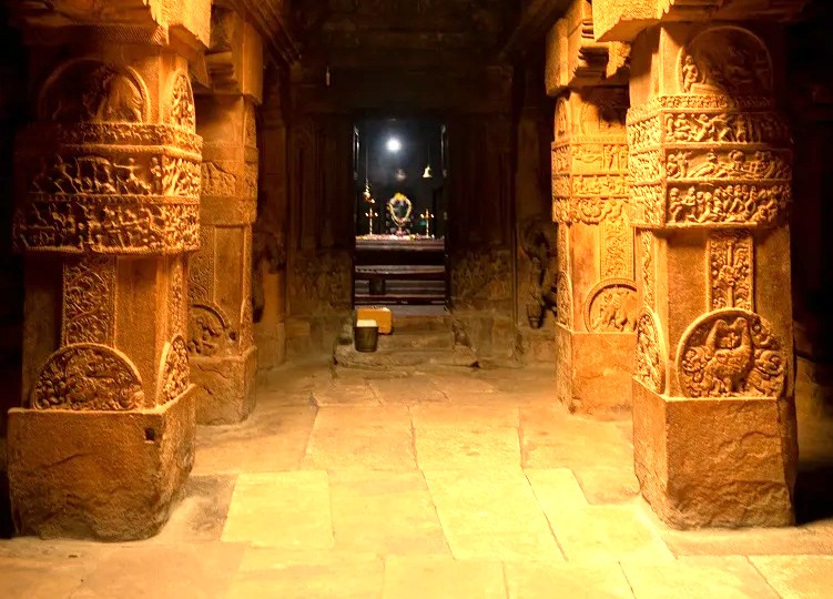 Massive, intricately carved pillars mark the sacred sanctuary inside the Sangameshwara Temple at the UNESCO World Heritage Site of Pattadakal, India, preserving Chalukyan history. Massive, intricately carved pillars mark the sacred sanctuary inside the Sangameshwara Temple at the UNESCO World Heritage Site of Pattadakal, India, preserving Chalukyan history.