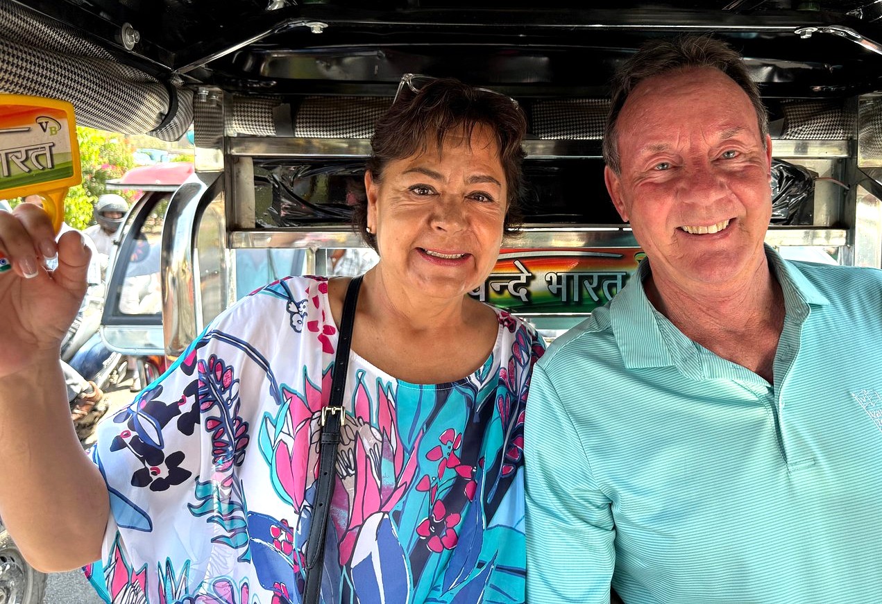 Smiling travelers enjoy local auto-rickshaw transport near the incredible UNESCO World Heritage Site of Pattadakal, India, embracing culture and historical exploration experiences. Smiling travelers enjoy local auto-rickshaw transport near the incredible UNESCO World Heritage Site of Pattadakal, India, embracing culture and historical exploration experiences.