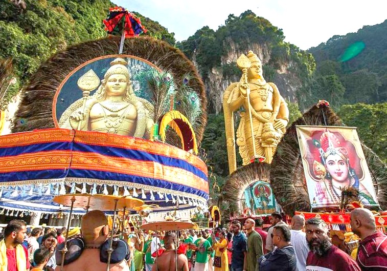 A vibrant Hindu temple festival procession in the Samarnar Hills near Madurai, Tamil Nadu, South India, featuring elaborately decorated deities, colorful umbrellas, and community celebration in a scenic hill backdrop. A vibrant Hindu temple festival procession in the Samarnar Hills near Madurai, Tamil Nadu, South India, featuring elaborately decorated deities, colorful umbrellas, and community celebration in a scenic hill backdrop.
