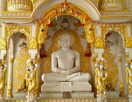 Intricately carved white marble Buddha statue in meditation posture at Savitri Temple shrine in Pushkar, Ajmer, Rajasthan, India, nestled between Jaipur and Agra en route to the iconic Taj Mahal.
