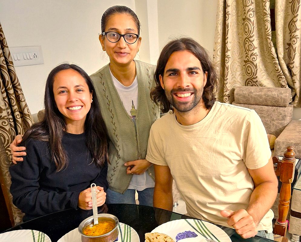 "Friends share traditional Indian meal at Shahganj Dargah in Aurangabad, Maharashtra, near UNESCO Ellora and Ajanta Caves, experiencing authentic local cuisine and vibrant warm hospitality in India’s historic cultural heart."