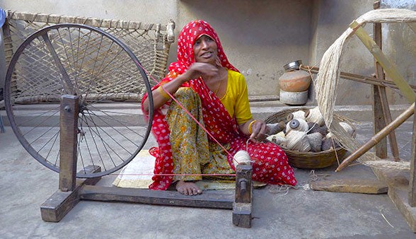 At Shalimar Weaves Shop in Kodaikanal, Palani Hills, Tamil Nadu, South India, artisans preserve traditional spinning heritage, showcasing unique vibrant handwoven textiles crafted with pride.