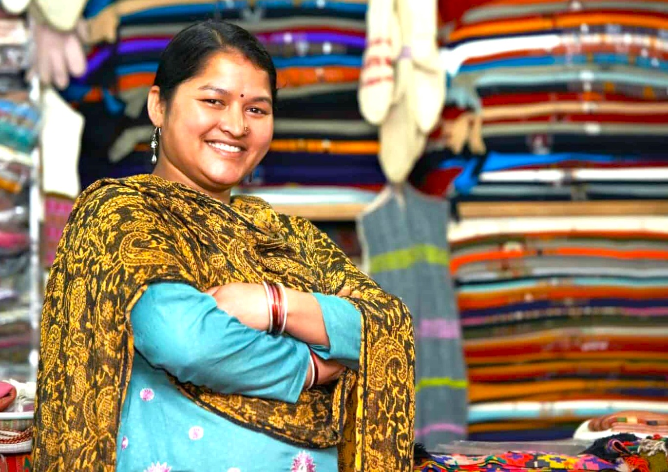 At Shalimar Weaves Shop in Kodaikanal, Palani Hills, Tamil Nadu, South India, artisans preserve traditional spinning heritage, showcasing unique vibrant handwoven textiles crafted with pride.