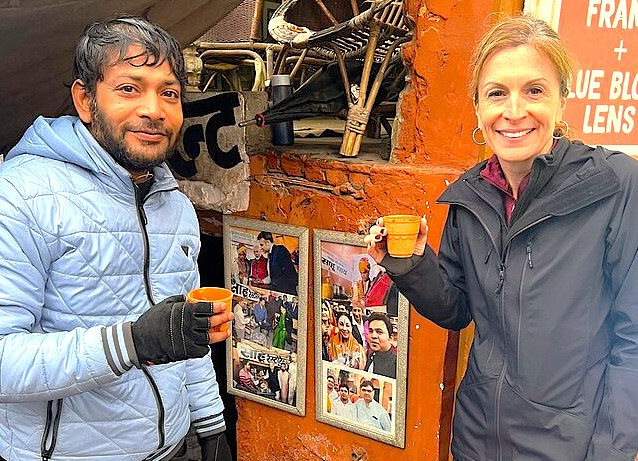 A smiling tourist enjoys local chai with a vendor near Shankaracharya Hill, embracing the culture of Srinagar, Kashmir-India, the UNESCO City of Arts, nestled in the Himalayas. A smiling tourist enjoys local chai with a vendor near Shankaracharya Hill, embracing the culture of Srinagar, Kashmir-India, the UNESCO City of Arts, nestled in the Himalayas.
