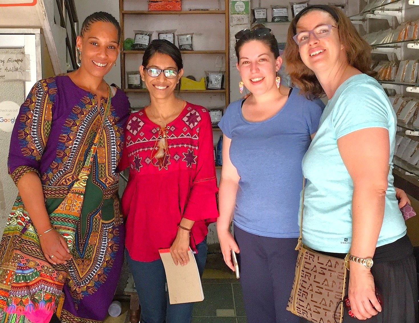 Four smiling women exploring a spice shop adjacent to the historic Tooji Ka Jhalra step well in Jodhpur, Rajasthan, India, highlighting local heritage, architectural features, artisanal crafts and cultural immersion. Four smiling women exploring a spice shop adjacent to the historic Tooji Ka Jhalra step well in Jodhpur, Rajasthan, India, highlighting local heritage, architectural features, artisanal crafts and cultural immersion.