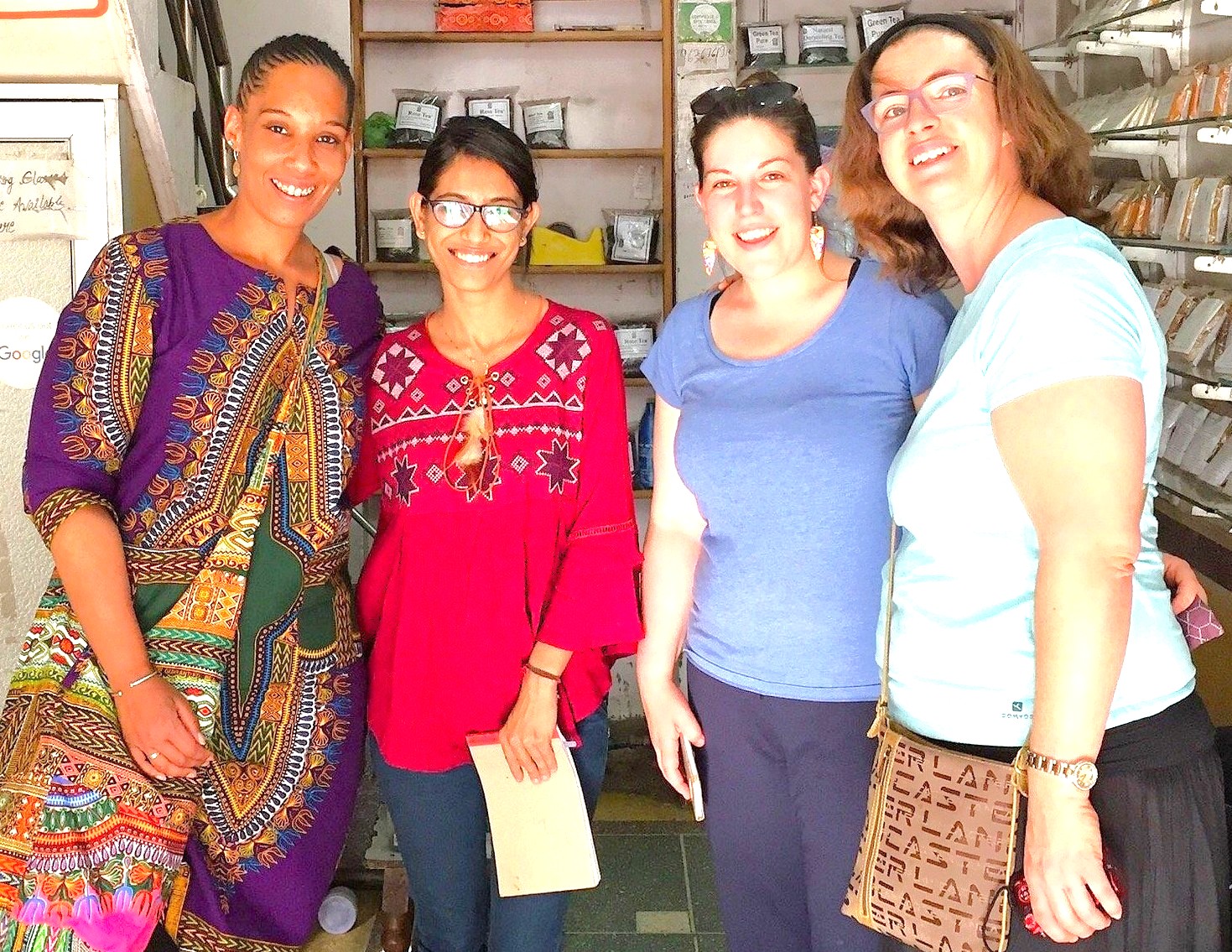 Four women build a friendly relationship while shopping at a local spice shop in Munnar, Kerala, a popular travel destination for tourists exploring India near the lush Unesco Western Ghats. Four women build a friendly relationship while shopping at a local spice shop in Munnar, Kerala, a popular travel destination for tourists exploring India near the lush Unesco Western Ghats.