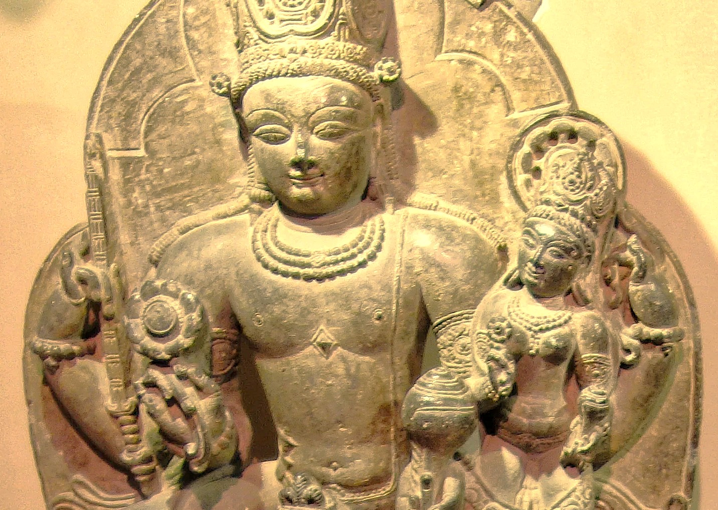 An ancient sculpture of Lord Vishnu and a consort, preserved in a Srinagar museum, reflecting the heritage near Shankaracharya Hill and the Himalayas in Kashmir-India. An ancient sculpture of Lord Vishnu and a consort, preserved in a Srinagar museum, reflecting the heritage near Shankaracharya Hill and the Himalayas in Kashmir-India.