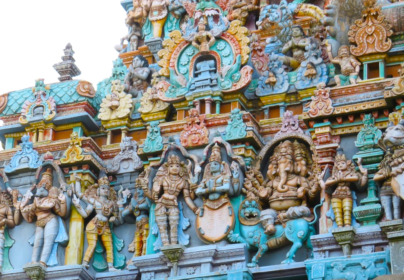 Vibrant South India temple facade in Tamil Nadu showcases intricate Dravidian architecture, colorful Meenakshi Temple sculptures of Hindu deities and mythological figures in Madurai, highlighting cultural heritage and spiritual symbolism. Vibrant South India temple facade in Tamil Nadu showcases intricate Dravidian architecture, colorful Meenakshi Temple sculptures of Hindu deities and mythological figures in Madurai, highlighting cultural heritage and spiritual symbolism.