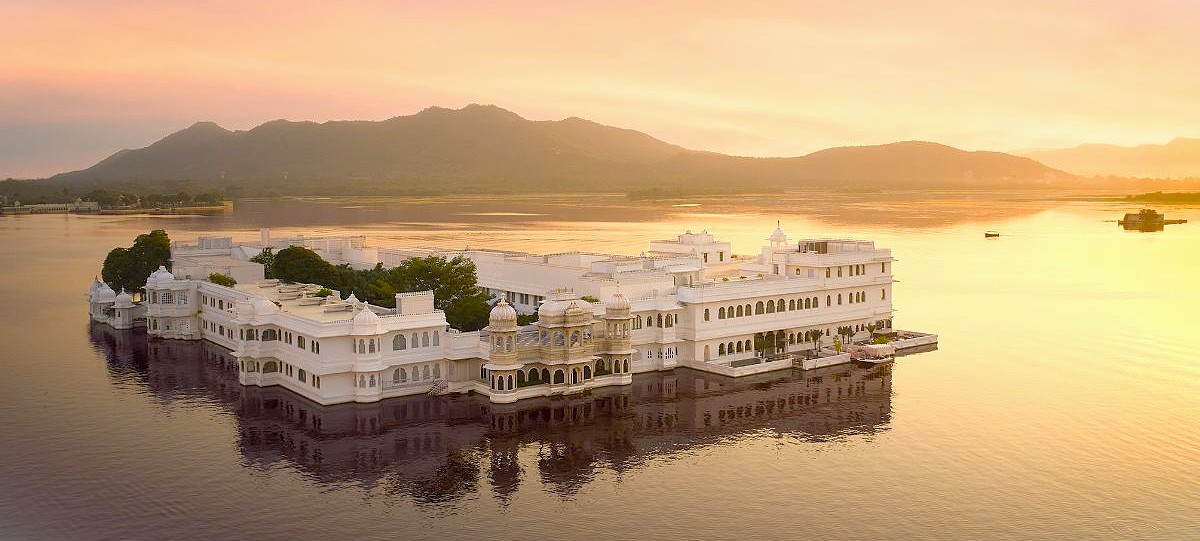 Discover the Taj Lake Palace in Udaipur, Rajasthan, India — a luxurious historic white marble heritage hotel floating on Lake Pichola, renowned for majestic Mughal-inspired architecture and unparalleled royal hospitality.
