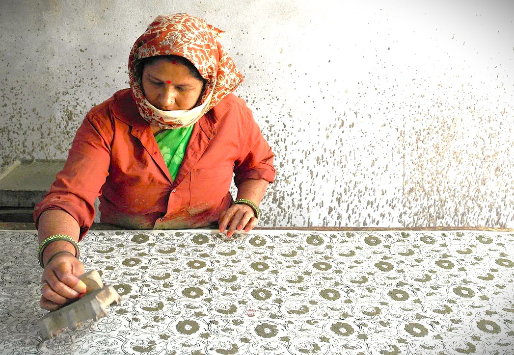 Indian artisan in Varanasi block printing fabric; connect this ancient craft with Delhi, Mumbai, and the Aurangabad-UNESCO Ellora caves region. Indian artisan in Varanasi block printing fabric; connect this ancient craft with Delhi, Mumbai, and the Aurangabad-UNESCO Ellora caves region.