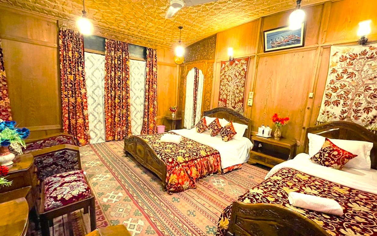 Luxurious Srinagar Houseboat stay with Kashmiri wood carving and rich textiles, providing perfect rest after exploring Pahalgam, Betaab and Aru Valleys, Sinthan Top, Dachigam National Park, and the majestic Gulmarg Gondola.