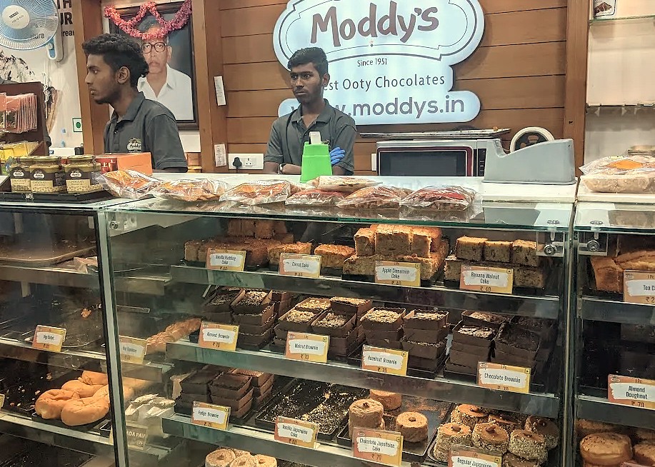 Moddys Chocolate, a must-visit Ooty landmark near the famed Dobetta Tea Plantation, sells fresh treats in India's beautiful UNESCO Western Ghats, perfect for visitors.