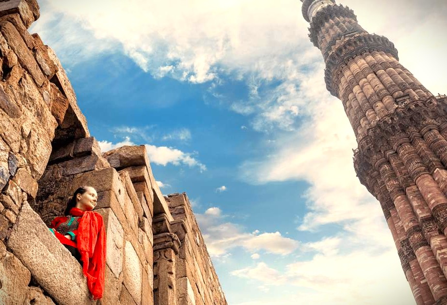India's Qutb Minar in Delhi, the world's tallest brick minaret, is an iconic red sandstone UNESCO World Heritage Site, essential for tourists to see and do.