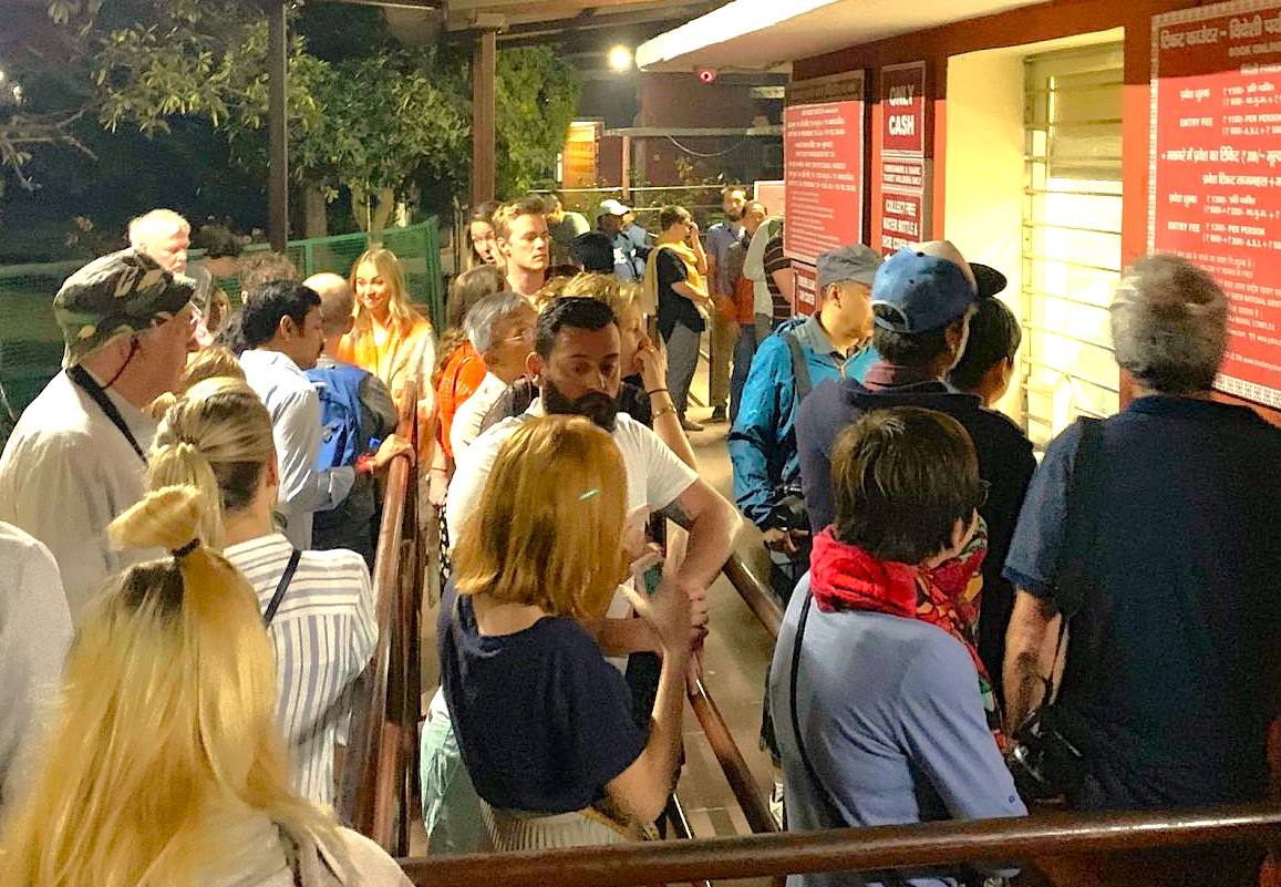 International tourists queueing for Taj Mahal tickets in Agra, India, at the official UNESCO site counter near the historical Agra Fort and Keoladeo National Park.