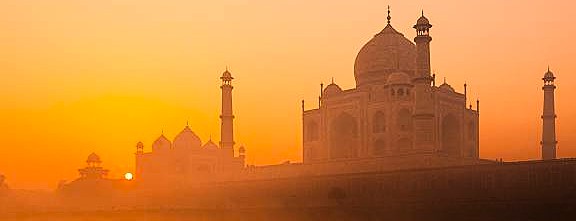 Majestic Taj Mahal UNESCO World Heritage Site in Agra, India, glowing at sunrise, near the historic Agra Fort and renowned Keoladeo National Park.