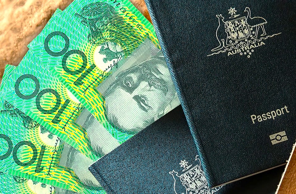 "Australian one hundred dollar notes alongside a passport illustrating the cost of different tour types in India, essential for comparing travel budgets between budget group tours and private luxury packages." "Australian one hundred dollar notes alongside a passport illustrating the cost of different tour types in India, essential for comparing travel budgets between budget group tours and private luxury packages."