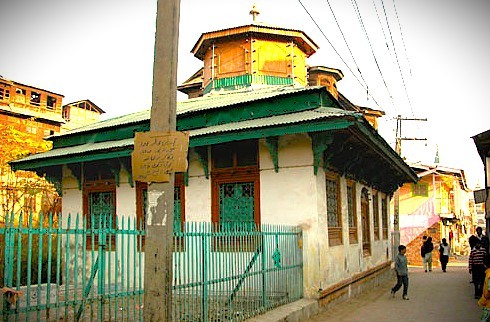 The modest Roza Bal shrine in Kashmir-Srinagar, India, a site of local pilgrimage, sits amidst the bustling city with views towards the Himalayas and Shankaracharya Hill, offering a glimpse into Srinagar's diverse spiritual landscape, though not specifically a Unesco City of Arts. The modest Roza Bal shrine in Kashmir-Srinagar, India, a site of local pilgrimage, sits amidst the bustling city with views towards the Himalayas and Shankaracharya Hill, offering a glimpse into Srinagar's diverse spiritual landscape, though not specifically a Unesco City of Arts.