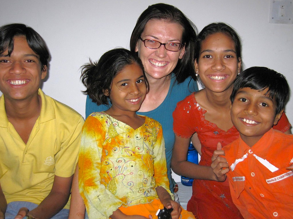 Group of smiling children and their guide at Bombay Panjrapole Cow Shelter in India-Mumbai-Mahapradesh, fostering educational tourism, community outreach, cultural connection, unique hands-on spiritual experience, social bonding, and joyful interaction. Group of smiling children and their guide at Bombay Panjrapole Cow Shelter in India-Mumbai-Mahapradesh, fostering educational tourism, community outreach, cultural connection, unique hands-on spiritual experience, social bonding, and joyful interaction.