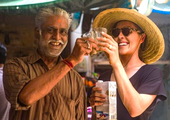 “Joyful scene in India’s vibrant street market: Kerala vendor and tourist toast chai glasses, celebrating authentic Karnataka flavors, cultural exchange, local food and travel experiences.” “Joyful scene in India’s vibrant street market: Kerala vendor and tourist toast chai glasses, celebrating authentic Karnataka flavors, cultural exchange, local food and travel experiences.”