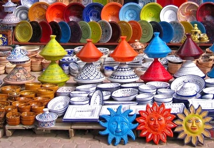 A vibrant collection of handcrafted pottery and colorful ceramics on display at a stall in the bustling Town Hall Markets of Coimbatore, Tamil Nadu, India, a popular shopping destination for tourists visiting the nearby hill stations of Kodaikanal and Ooty. A vibrant collection of handcrafted pottery and colorful ceramics on display at a stall in the bustling Town Hall Markets of Coimbatore, Tamil Nadu, India, a popular shopping destination for tourists visiting the nearby hill stations of Kodaikanal and Ooty.