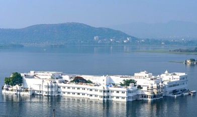 “Elegant white Taj Lake Palace floating majestically on Lake Pichola, framed by verdant Aravalli hills, epitomizing luxurious Rajput heritage at Ambrai Ghat, Udaipur, Rajasthan, India’s iconic and serene lakeside landmark.” “Elegant white Taj Lake Palace floating majestically on Lake Pichola, framed by verdant Aravalli hills, epitomizing luxurious Rajput heritage at Ambrai Ghat, Udaipur, Rajasthan, India’s iconic and serene lakeside landmark.”