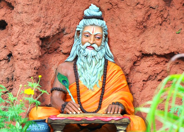 A colourful statue of a Hindu sage writing at Utsav Rock Garden in Hubli, Karnataka, India, a cultural stop on a road trip near-Goa's Unesco Churches. A colourful statue of a Hindu sage writing at Utsav Rock Garden in Hubli, Karnataka, India, a cultural stop on a road trip near-Goa's Unesco Churches.