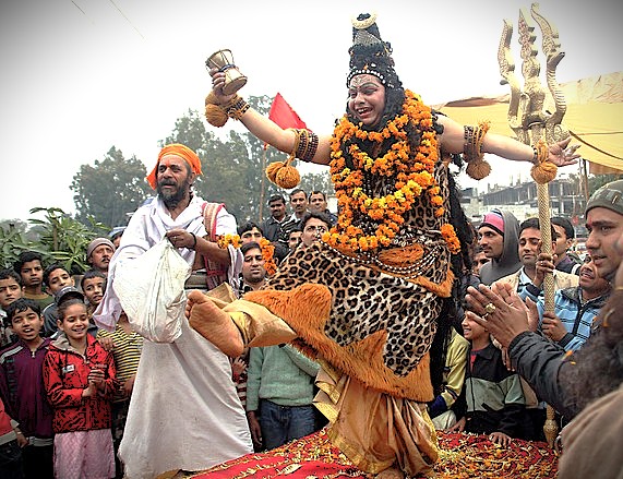 A vibrant devotional performance depicting Lord Shiva during a festival in Kashmir-India, showcasing the spiritual energy revered at temples like Vishveshwara Temple, Anantnag, and Shankaracharya Hill near Srinagar. A vibrant devotional performance depicting Lord Shiva during a festival in Kashmir-India, showcasing the spiritual energy revered at temples like Vishveshwara Temple, Anantnag, and Shankaracharya Hill near Srinagar.