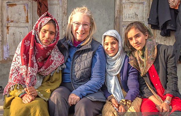 A smiling tourist poses with local Kashmiri girls near Anantnag, reflecting the welcoming community spirit around Vishveshwara Temple and the UNESCO City of Arts, Srinagar, in Kashmir-India. A smiling tourist poses with local Kashmiri girls near Anantnag, reflecting the welcoming community spirit around Vishveshwara Temple and the UNESCO City of Arts, Srinagar, in Kashmir-India.