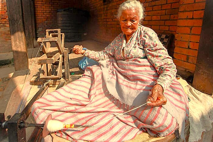 The relationship between artisans and wildlife is part of life in Lepakshi, Andhra Pradesh, India, where traditional crafts and curious monkeys coexist near the temple's famous hanging pillar.